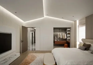 Spacious, minimalist bedroom with white walls, wooden floors, and marble accents.
