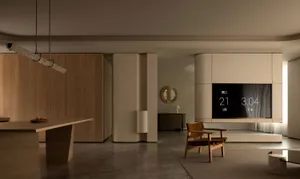 A modern minimalist living room with wooden furniture and light-colored walls and floor.