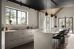 A modern residential kitchen featuring white cabinets and countertops, a large island, and a large window.