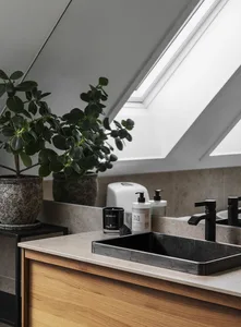 Modern minimalist bathroom featuring concrete countertops and wood sink