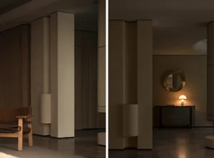 Modern minimalist interior with concrete walls and floor, featuring sleek, simple lines and a warm, inviting atmosphere.