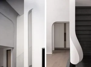 An interior space showcasing modern minimalist design with wooden elements.