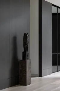 An industrial-style interior design with a wooden piece of furniture or art.