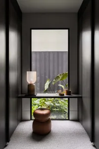 Minimalist interior design featuring wood elements in a small space setting.