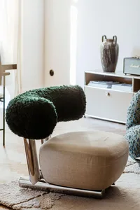 A cozy living room with plush fabric furniture and modern design elements.