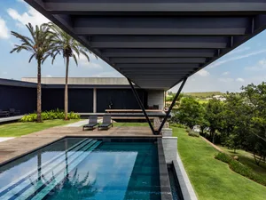 An image of a minimalist residential house with a concrete exterior.