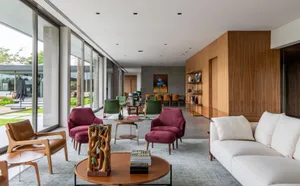 Modern living room featuring sleek, contemporary decor with wood, leather, and fabric elements.