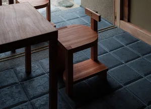 A minimalist interior design featuring wooden furniture.
