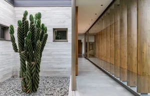 Modern interior design featuring concrete and glass materials.