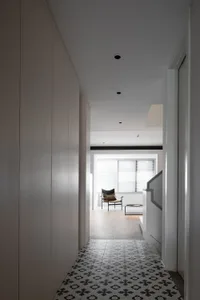 A modern interior space with a tiled floor.