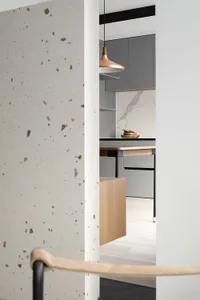 Modern kitchen with terrazzo, marble, and copper accents