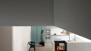 A modern residential kitchen with white marble cabinets, a minimalist design, and a sleek, contemporary feel.