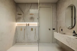 Modern minimalist bathroom with marble walls and cement floor