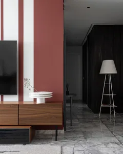 Modern minimalist living room with wooden cabinets, marble floor, and metal accents.