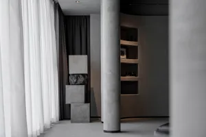 A minimalist space featuring concrete elements.