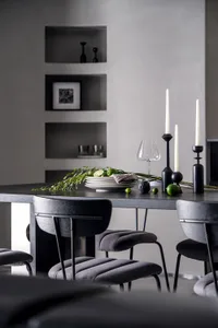 Modern dining room featuring ceramic and glass elements.