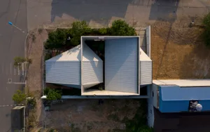 A modern metal building with geometric shapes and clean lines.