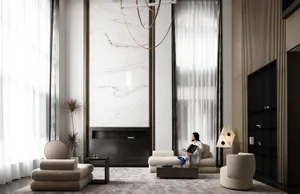 A modern living room featuring marble, concrete, and textured fabric materials.