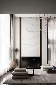 Modern minimalist living room with white marble accent wall, floor-to-ceiling windows, and contemporary furniture.