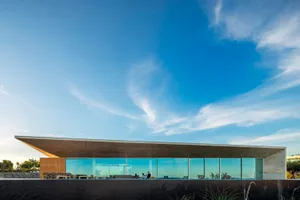 A modern building with glass and concrete exterior features.