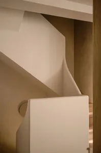 Modern, minimalist concrete stairs leading to a second level in a contemporary design.