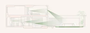 A contemporary residential section with glass and concrete elements, showcasing modern design.