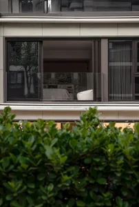 A modern residential interior with concrete walls and minimalist decor.