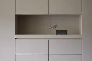 A minimalist storage cabinet in neutral tones featuring a minimalist design.