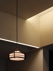 A modern interior design featuring metal and glass lighting fixtures.