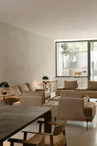 Modern living room featuring neutral-toned furniture and decor.