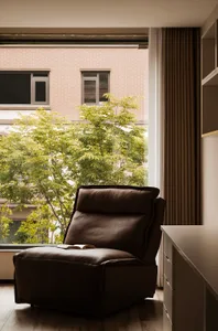 Leather armchair in minimalist interior