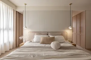 Modern bedroom with minimalist design, neutral colors, and a comfortable bed.