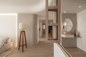 A modern residential living space featuring minimalist design elements and a neutral color palette.