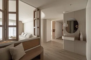 A modern minimalist living room adorned with wooden elements.