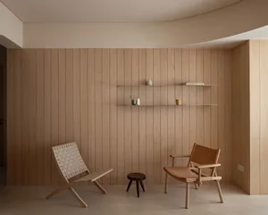 Modern interior space featuring wooden paneling, minimalist furniture, and a sleek, contemporary design.