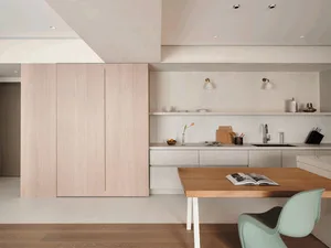 A contemporary kitchen with minimalist design features, showcasing clean lines and natural wood materials for a stylish and f