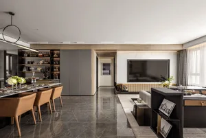 Modern living room featuring a marble floor and a large flat-screen television.