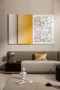 Contemporary living room with a gray sectional sofa, abstract art, and minimalist decor.
