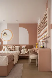 A minimalist bedroom with neutral-toned textiles