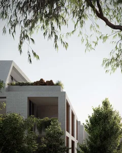 Rendering of a minimalist building with brick exterior, featuring a rooftop garden and greenery.