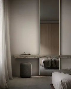 Modern bedroom featuring sleek, minimalist design with concrete elements.