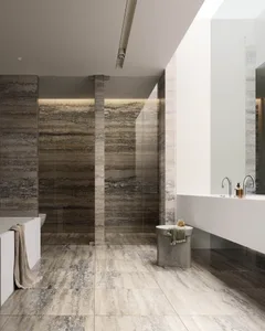 Modern bathroom with marble flooring and walls, featuring a large soaking tub and minimalist design.
