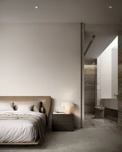 Modern minimalist bedroom with a bed, nightstand, and light fixture.