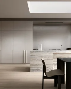 A modern minimalist kitchen featuring marble countertops and sleek design elements.