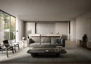 A modern, monochrome living room with neutral textures, featuring a grey couch, wooden coffee table, and large windows with c
