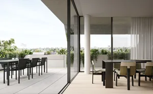 Outdoor dining area with modern furniture and plants