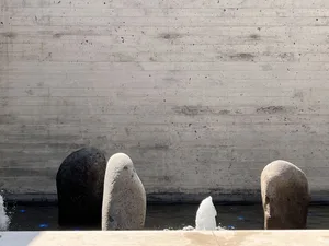 Concrete sculptures in a modern garden setting.