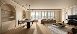 Modern living room with wooden furniture, white walls, and large windows
