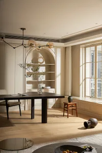 A modern residential dining room featuring a dark wooden table and natural wood finishes.