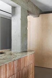 Modern interior with concrete and wooden elements.